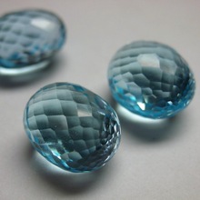 egg shape natural faceted blue topaz gemstone