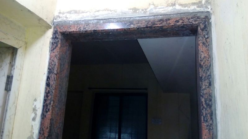 Solid brown granite door frame with champer