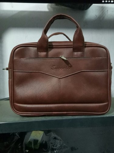Plain Leather Brown Office Bag, Feature : Adjustable Strap, Dirt Resistant, Water Proof