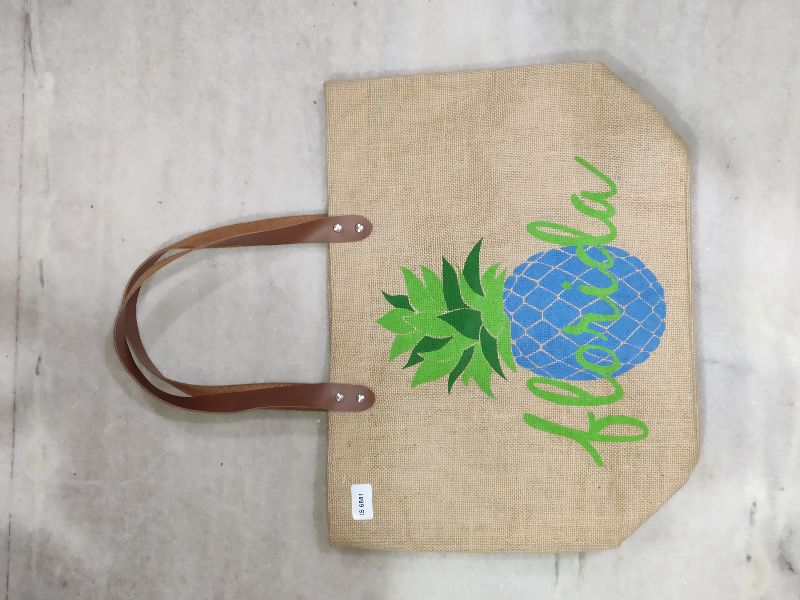 Jute Bag With Brown Rexine Handle.