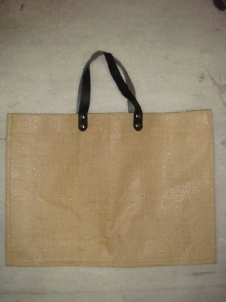 NATURAL JUTE BAG WITH REXINE HANDLE  .