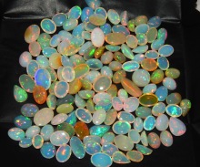 Oval Polished Natural Ethiopian Opal Gemstone, for Jewellery, Size : Standard