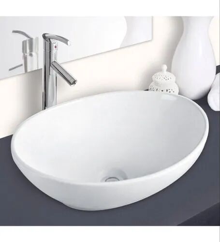 Plain Ceramic table top wash basin, Shape : Oval