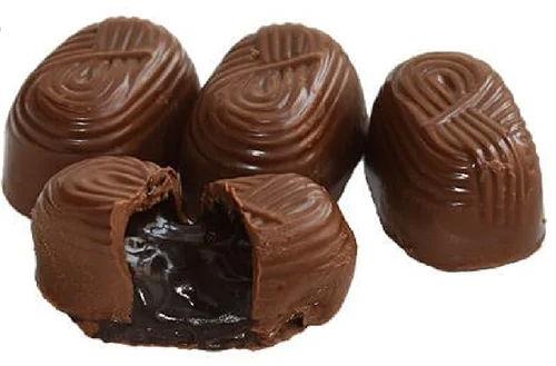 Brown Handmade Centre Filled Chocolates, For Eating Use, Bakery, Diwali Gifts, Taste : Sweet