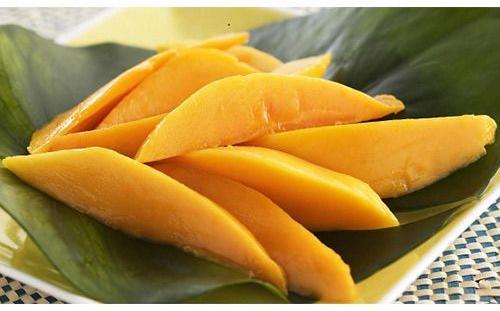 Yellow Common Frozen Mango Slices, for Human consumption, Feature : Natural Taste