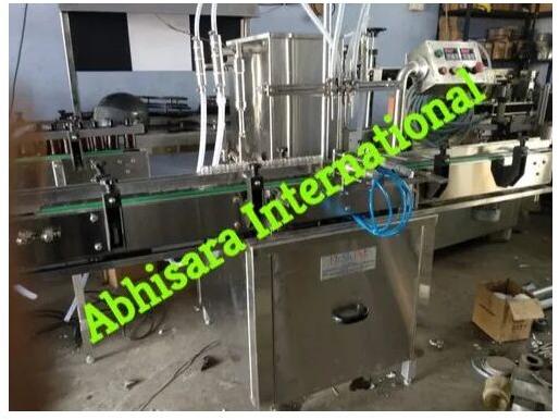 Abhisara International Automatic 750 Kg Approx Volumetric Liquid Filling Machine