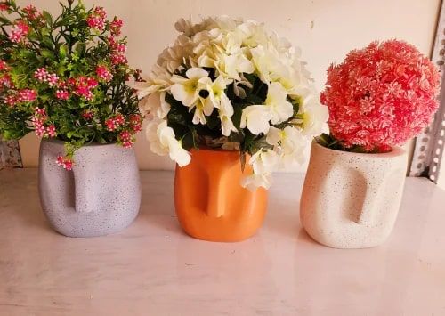 Polyresin Human Face Pots, for Plantation, Feature : Perfect Shape, Decorative