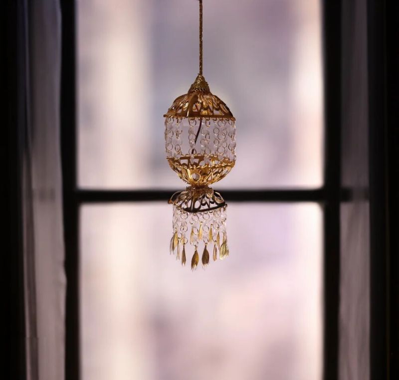 Polished Glass Hanging Chandelier, for Banquet Halls, Home, Hotel, Restaurant, Feature : Attractive Designs