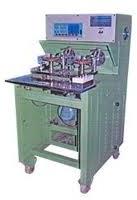 Coil tapping machine