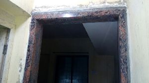 Solid brown granite door frame with champer