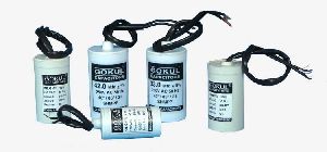 Capacitors for submersible pump panels