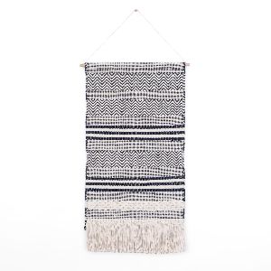 Textured black and white wall hanging
