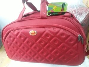 Plain Polyester Red Travel Bag, Style : Duffle