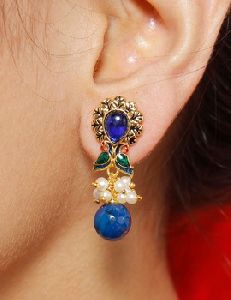 peacock style with pearl drop earrings
