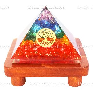 7 Chakra Stone Orgone Vastu Pyramid With Golden Round Fengshui Symbol And Brown Wooden Stand