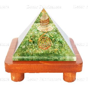 Orgone Green Aventurine Stone Vastu Pyramid with Round Spring Symbol On a Brown Wooden Stand