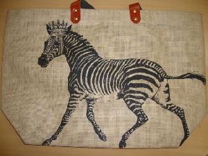 JUTE BAG WITH BLACK PRINT AND REXINE HANDLE