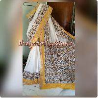 Golden yellow bordered kerala cotton sari