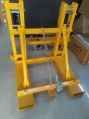 Yellow forklift drum lifter attachment