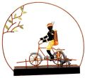 Wrought Iron Tribal Man Riding Bicycle Dog Figurine